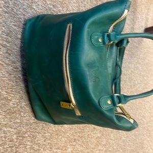 used one day ..... real leather purse with strap for backpack.